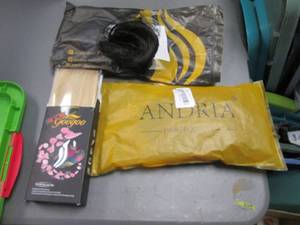 lot 63 image: Andria Real Hair wigs in a covered tote