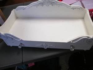lot 71 image: Painted Wood decorative Doll bed with storage drawer underneath.