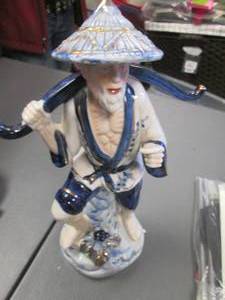lot 82 image: Intricately Detailed Porcelain Japanese Fisherman Statue