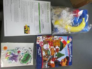 lot 308 image: Kitchen Concoctions Science Type projects, Christmas Cabin Playset as well as a package of waterproof stickers