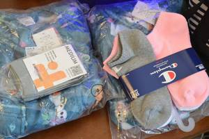 lot 109 image: Assorted Lot Pajamas, Socks, Vegetable Slicer, Vase, Tote Bag