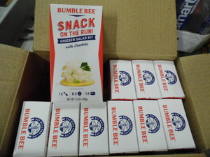 lot 108 image: Near fill case of Bumble Bee Chicken Salad Snack on the go kits with crackers
