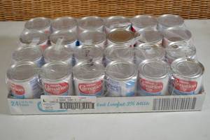 lot 463 image: Flat of Carnation Evaporated Lowfat 2% Milk - 24 12oz Cans Best by 10172023