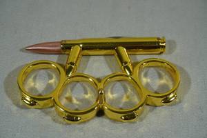 lot 106 image: Novelty Belt Buckle with Bullet Casing Knife