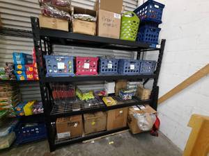 lot 122 image: Black storage rack with 4 ventilated shelves