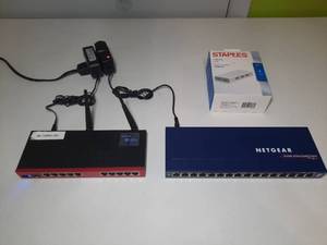 lot 194 image: MikroTik Router BOARD 2011UAS-2HnD, Netgear ProSafe 16 Gigabit Switch, Staples USB Hub, DVE switching adapter