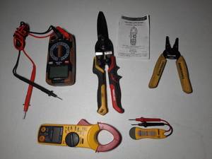lot 240 image: CE AC Digital Clamp Meter. Southwire Multi Meter. Klein Tools Wire Stripper. Craftsman Straight Long Cut Aviation Snips.. Tester