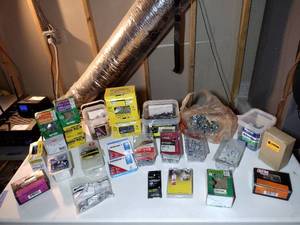 lot 219 image: Boxes of hardware, mostly screws.