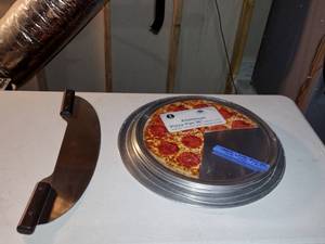 lot 236 image: (4) 16 Aluminum Pizza Pans. (1) 18 Pizza Pan. (1) 19 Pizza Pan. American Metalcraft Pizza Rocker Knife, PKR20