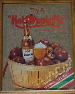 lot 63 image: Vintage TUACA Italian Liqueur Mirrored Sign Hot Apple Pie