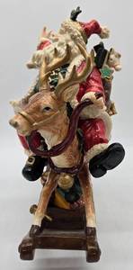 lot 113 image: Porcelain Ceramic Santa on Rocking Horse Reindeer