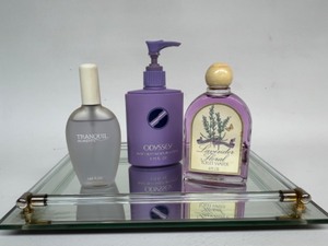 lot 123 image: Mirrored Glass Tray with AVON Collectible Perfume, Lotion, & Toilette Water