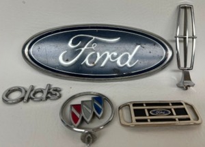 lot 195 image: Vintage FORD Buick Oldsmobile Automobile Decals Hood Ornaments & More