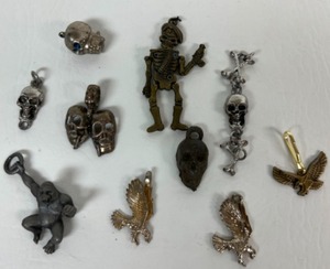lot 248 image: Vintage Lot of Cast Metal SKULLS & SKELETONS, Money Ring, King Kong & Eagle Charms