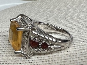 lot 252 image: Large Citrine Stone with Ruby Crystal Side Stones set in 925 Sterling Silver