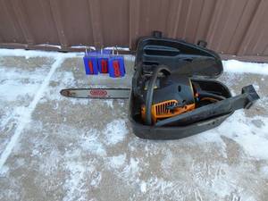 lot 108 image: Poulan Pro 18 oregon bar saw in good shape. Runs but has a fuel leak with case. As shown.