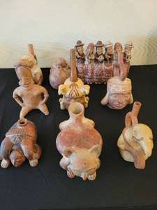 A group of 9 Pre Colombian Style reproduction figures.
