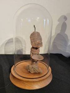 An Vintage Pre Colombian Figure with Protective Glass Dome.
