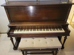 Kimball Upright Piano with Bench and Sheet Music.