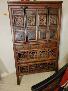 Chinese 19th Century Brown Cabinet with Fretwork Doors and Three Drawers.