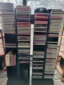 A large lot of approximately 140 mainly classical CDs with stands.