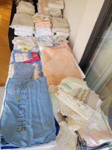 A very large collection of vintageantique linens. Tablecloths, napkins, hankies, dollies etc.