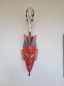 A large Hand Carved & Painted African Wood Tribal Mask.