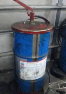 lot 58 image: Partial Barrel of Delo Syntrans HD SAE 50 with Hand Pump on Rolling Cart