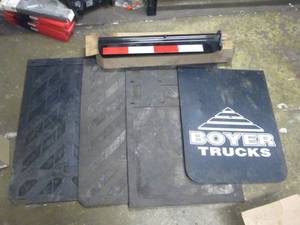 lot 168 image: 4-New Asst Mud Flaps & New Mud Flap Hanger