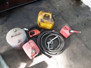 lot 84 image: Gas Nozzles, Hose, and Assorted Gas Cans
