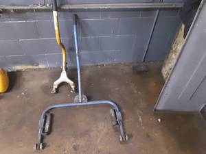 lot 111 image: OTC 5096A Wheel dolly and Tire Dismount Tool