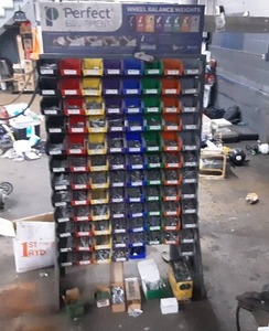 lot 117 image: Perfect Equipment Wheel Weight Organizer Rack and Bins Full of Tire Balance Weights (.25 to 3 oz)