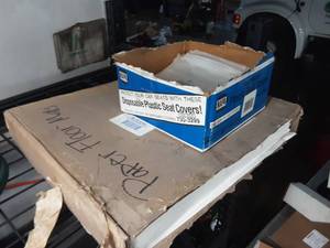 lot 267 image: paper floor mats and plastic seat covers