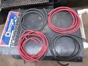 lot 295 image: heavy duty copper battery cables and display rack