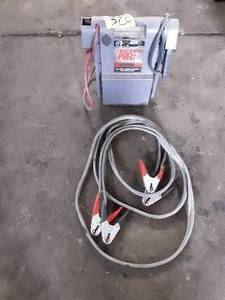 lot 320 image: 12V Truck Pac by Booster Pac E56000, 3000 Peak amps and Jumper Cables