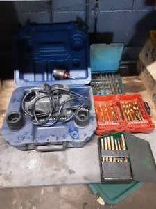 lot 339 image: Drill Docter and 3 Partial Drill Bit Cases