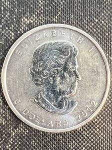 lot 13 image: 1 TROY OZ .9999 FINE SILVER 2012 CANADIAN MAPLE LEAF