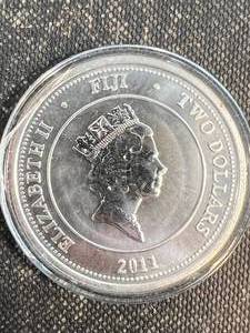 lot 30 image: 1 TROY OZ .999 FINE SILVER 2011 FIJI ROUND IN AIRTITE
