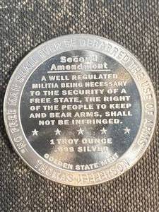 lot 32 image: 1 TROY OZ .999 FINE SILVER 2ND AMENDMENT ROUND