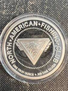 lot 39 image: 1 TROY OZ .999 FINE SILVER NORTH AMERICAN FISHING CLUB ROUND