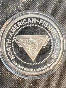 lot 41 image: 1 TROY OZ .999 FINE SILVER NORTH AMERICAN FISHING CLUB ROUND