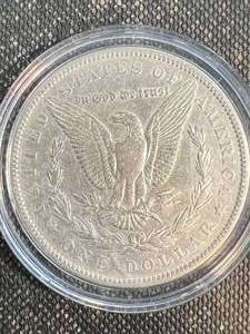 lot 43 image: 1878 US MORGAN SILVER DOLLAR IN AIRTITE