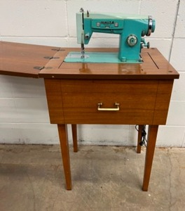 lot 56 image: Vintage WHITE Sewing Machine in MCM Cabinet