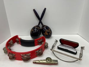 lot 527 image: One Man Band Intruments Inculding a Tamborine, Harmonica with Neck Holder, Kazoo and Maracas