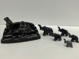 lot 544 image: Vintage Resin Carved Eskimo Scene with Marble Elephants Following in a Row