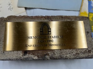 lot 624 image: Vintage UNIVERSITY of MINNESOTA Collectibles Item Including a Brick from the Original Stadium