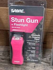 lot 1293 image: Sabre Stun Gun  Flashlight with Belt Holster S-1005
