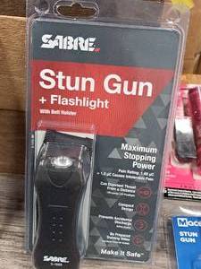 lot 1295 image: Sabre Stun Gun  Flashlight with Belt Holster S-1005
