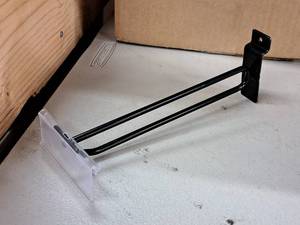 lot 1303 image: Lot of (32) 9 Slat Wall Pegs with Price Tag Holders