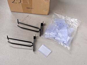 lot 1305 image: Lot of (25) 5 Slat Wall Pegs with Price Tag Holders